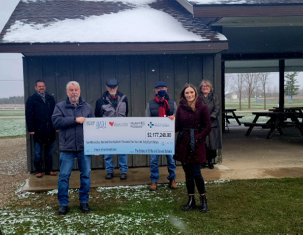 Foundation Members hold a cheque for over $2 million dollars